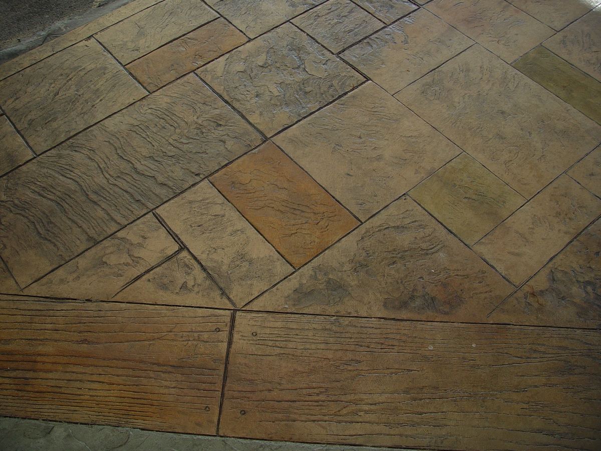 Finished stamped concrete surface with a textured stone-look pattern